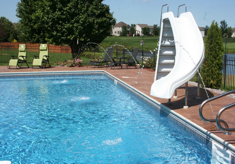 performance pool spa inground pool with a water slide and fountains 